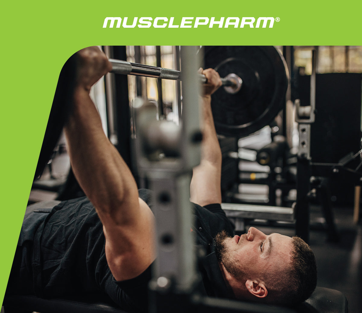 MusclePharm Weekly Workout graphic featuring a male athlete performing an incline barbell press on a bench in a gym.