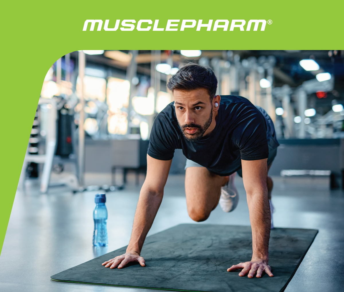 MusclePharm Weekly Workout 06 graphic featuring a man performing mountain climbers on an exercise mat in a gym.